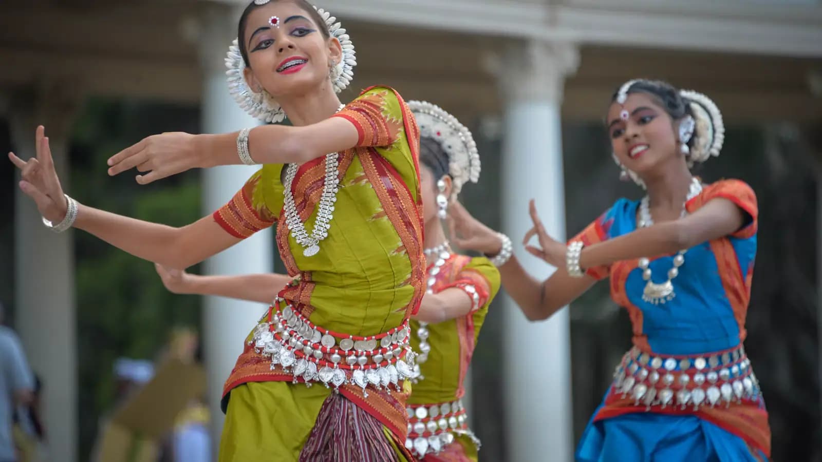 Dancers performing a traditional Polynesian dance on an outdoor stage